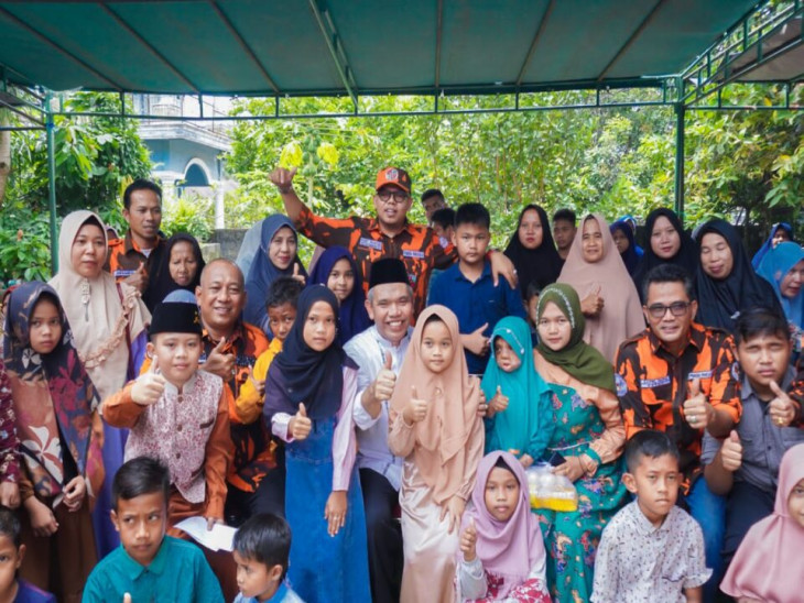 Pj. Bupati Kampar Serahkan Santunan kepada 63 Anak Yatim Sempena HUT Pemuda Pancasila Ke-63 di Kuok