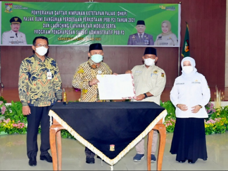 Bupati Kampar Lounching Tax Mobile Sekaligus Serahkan Daftar Himpunan Ketetapan Pajak
